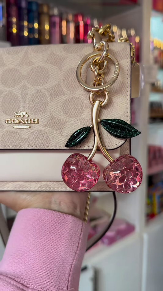 Elegant Designer Crossbody Bag with Signature Pattern and Chain Strap