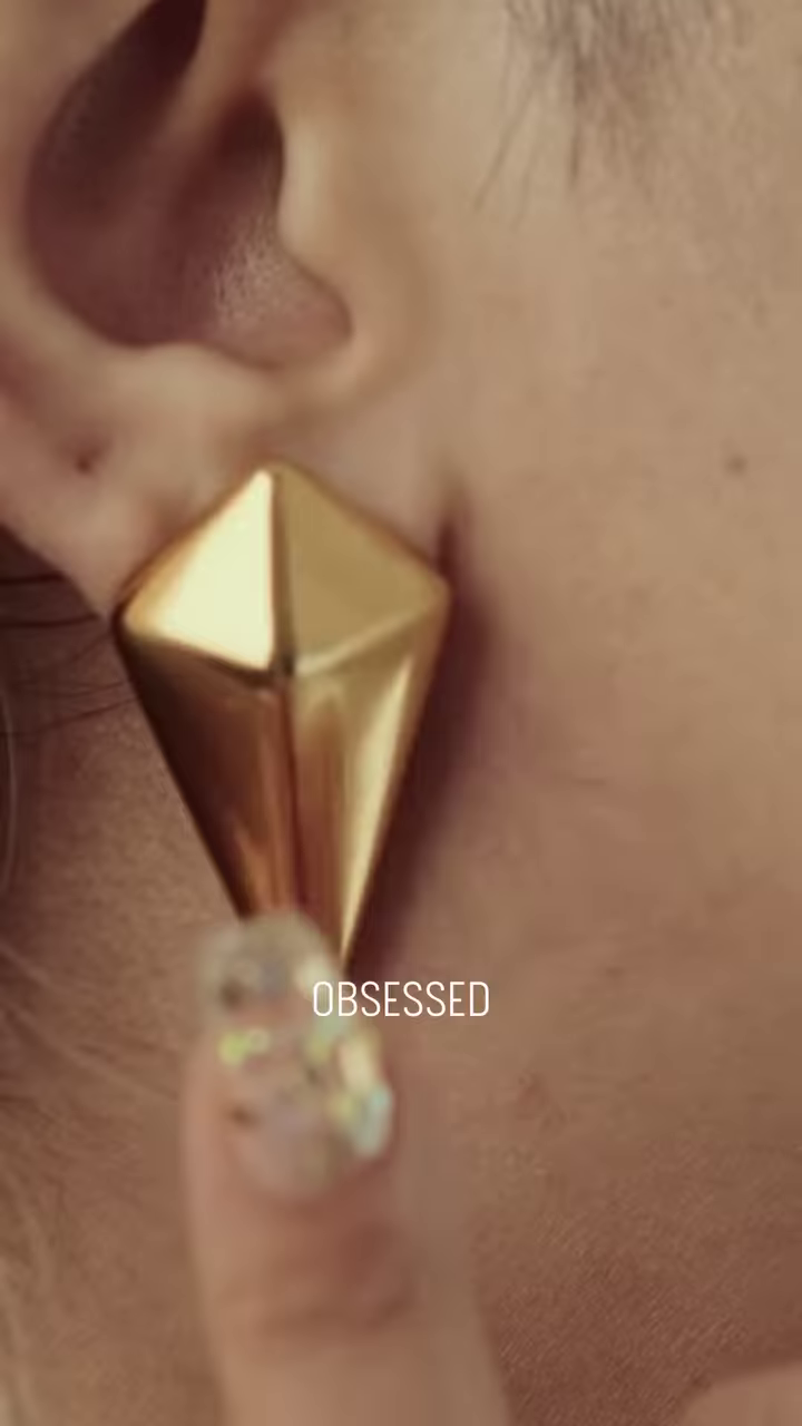 Close-Up of Stylish Gold-Toned Earrings: Teardrop, Stud, and Mesh Hoop