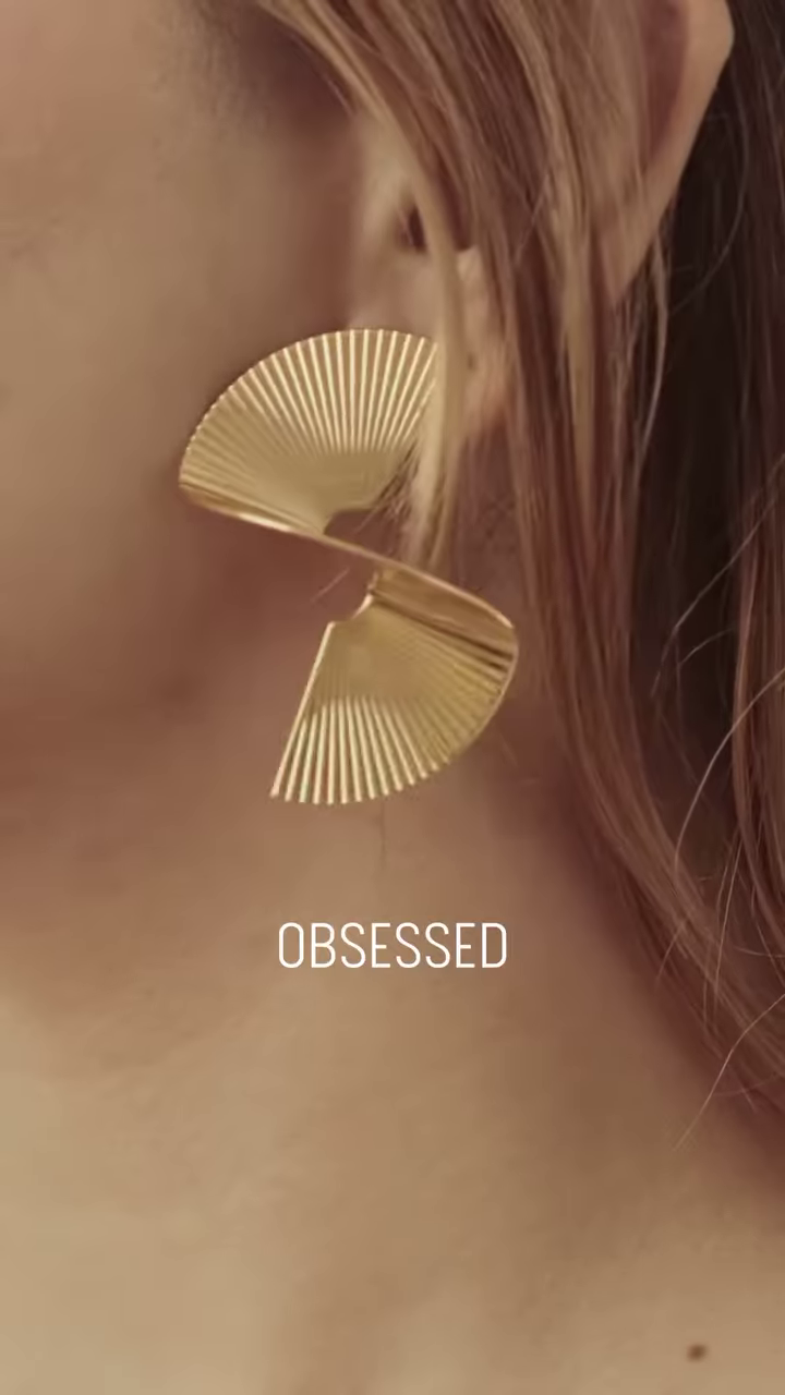Close-Up of Stylish Gold-Toned Earrings: Teardrop, Stud, and Mesh Hoop