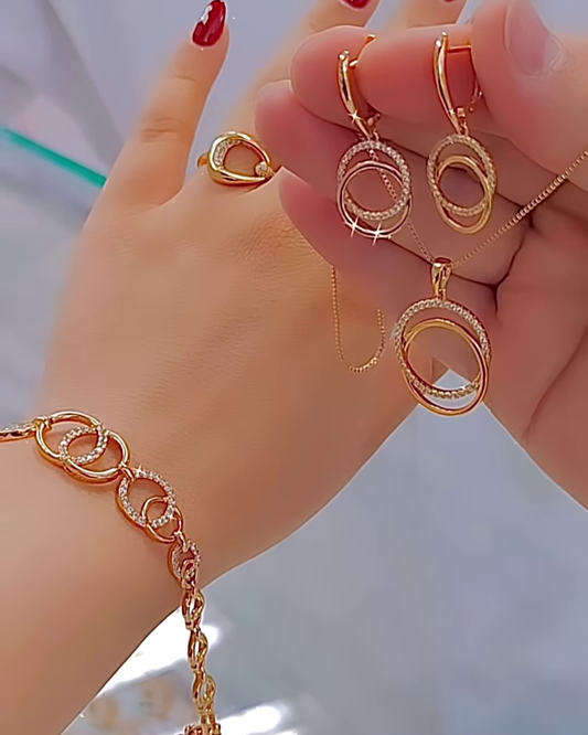 Elegant Rose Gold Tone Jewelry Set with Interlocking Circle Design and Sparkling Accents