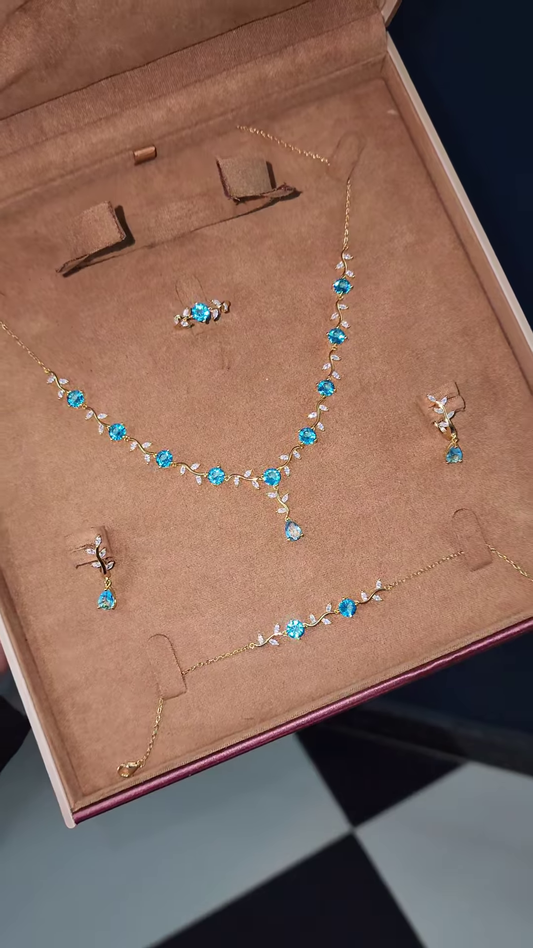 Elegant Gold-Toned Ring with Blue Gemstone Floral Design