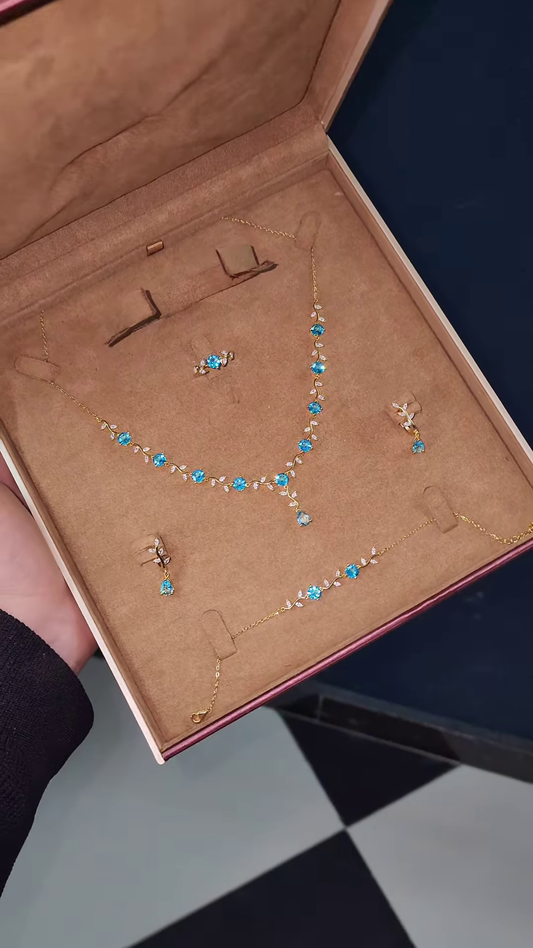 Elegant Gold-Toned Ring with Blue Gemstone Floral Design