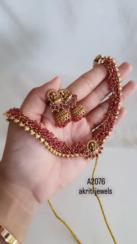 “Temple Heritage: Gold-Toned Pearl Choker & Jhumka Set