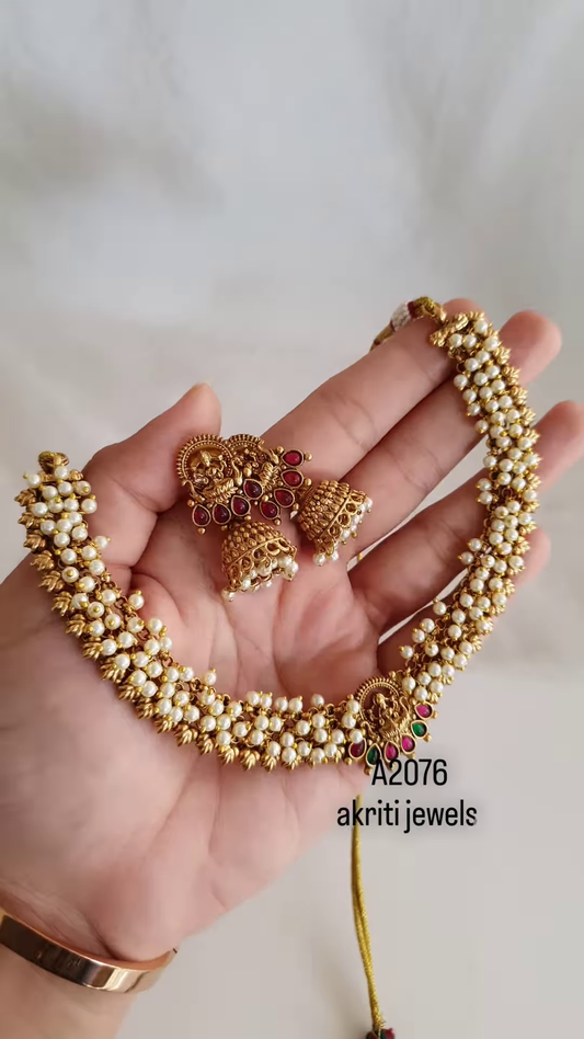 “Temple Heritage: Gold-Toned Pearl Choker & Jhumka Set