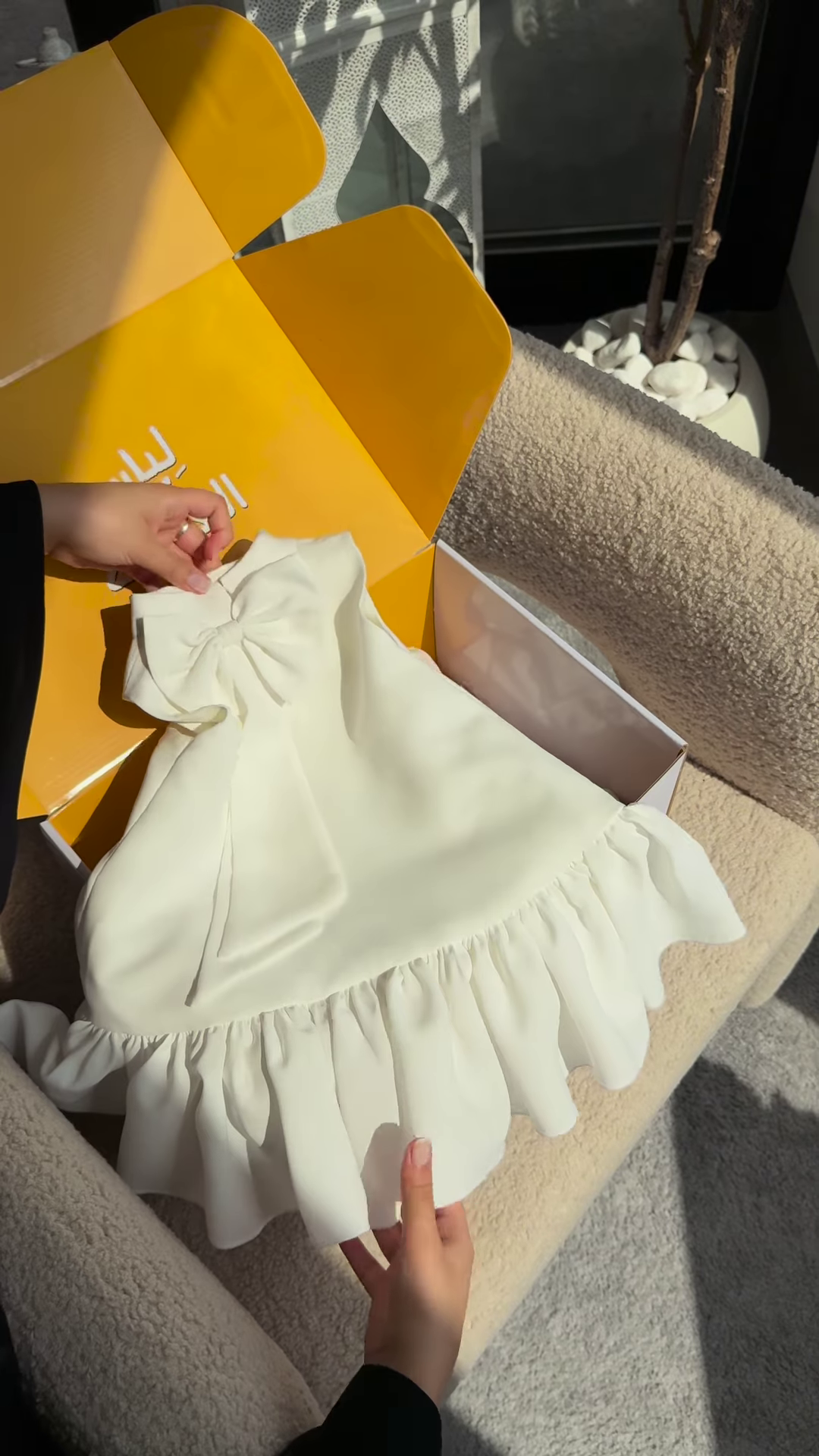 Elegant White Dress with Ruffled Hem and Bow Detail