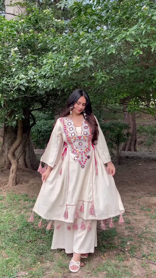 Cream-Colored Embroidered Traditional Dress with Colorful Circular Motifs and Pink Tassel Accents