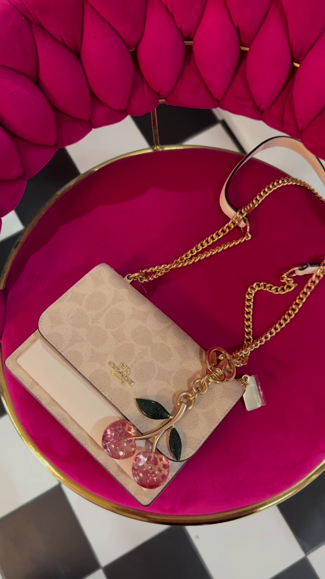 Elegant Designer Crossbody Bag with Signature Pattern and Chain Strap