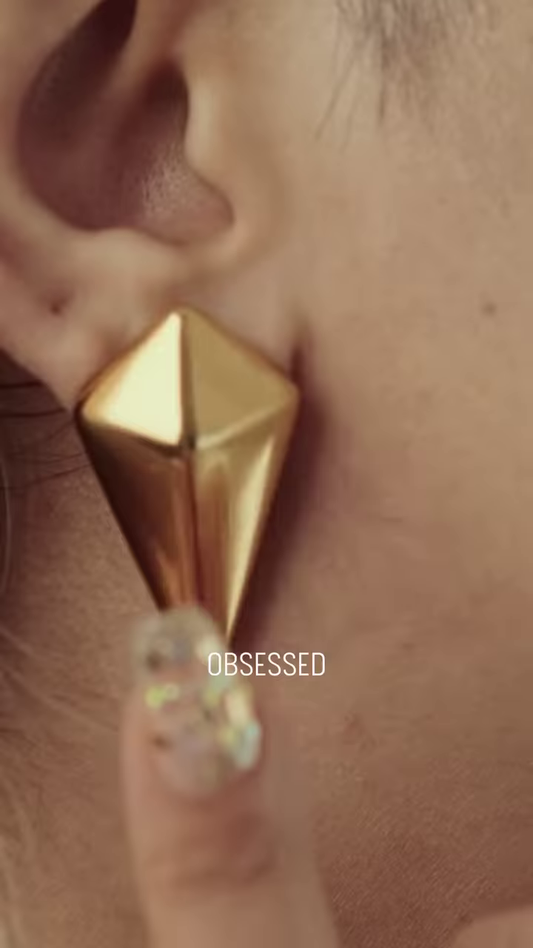 Close-Up of Stylish Gold-Toned Earrings: Teardrop, Stud, and Mesh Hoop