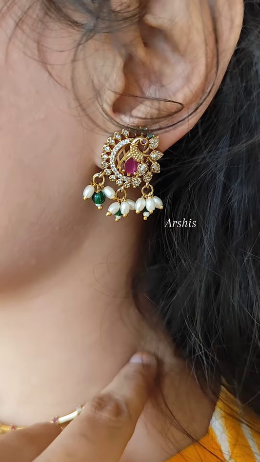 Elegant Gold-Toned Hasli Necklace with Peacock Pendant, Kundan, and Pearl Drops