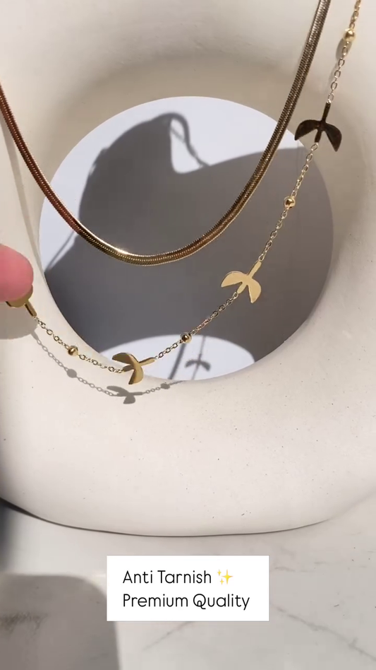 Delicate Layered Gold-Toned Necklace with Four-Leaf Clover and Pearl Pendants
