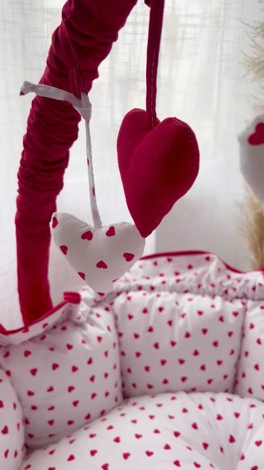 Cozy Baby Bassinet with Heart Print and Hanging Heart Mobiles