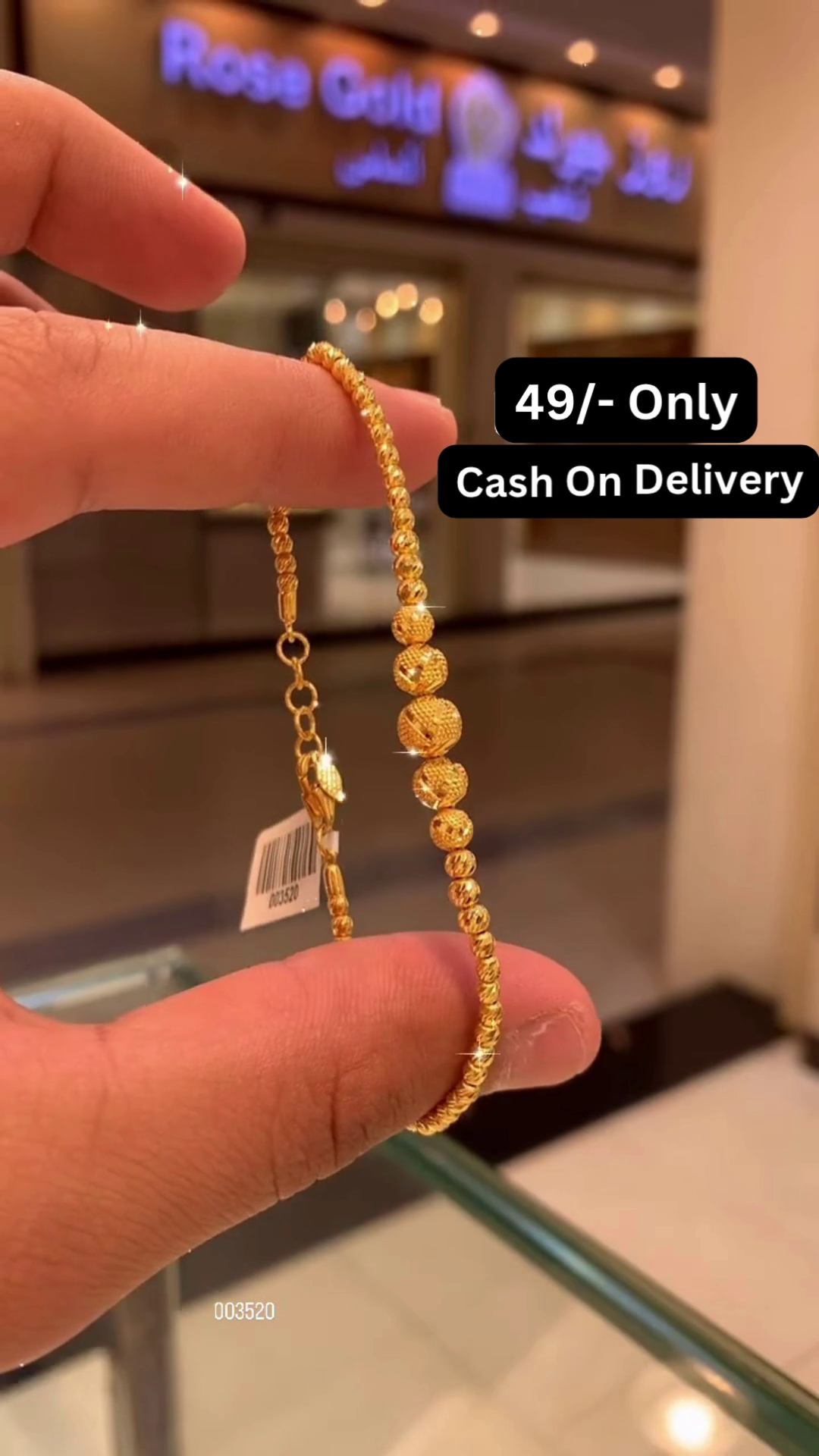 Elegant Gold-Toned Beaded Bracelet with Intricately Patterned Spherical Accents